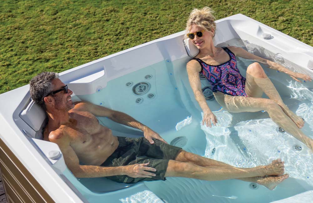 Couple Lounging In Clean Hot Tub