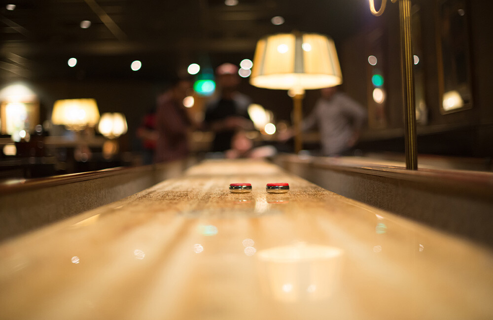 Family Playing Shuffleboard