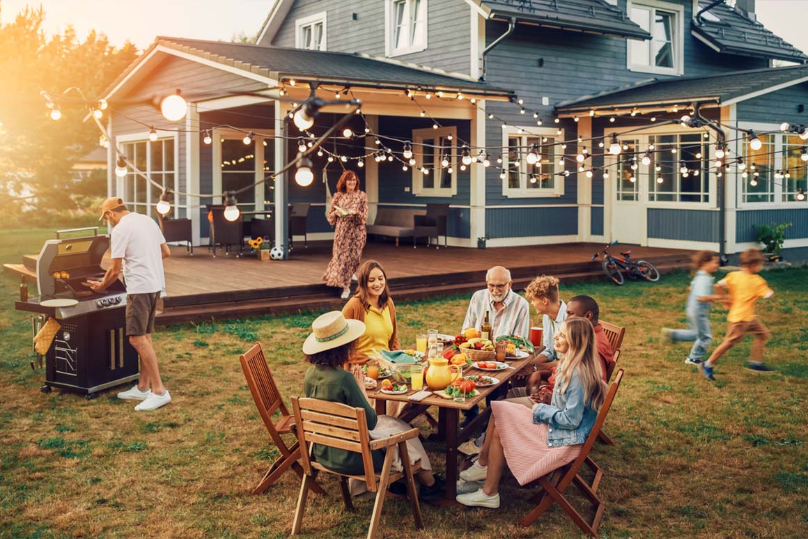 Family Sitting In Outdoor Dining Set