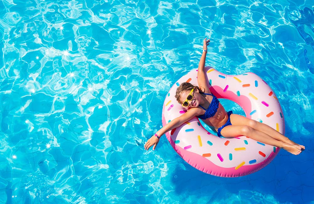 Girl Floating In Above Ground Pool
