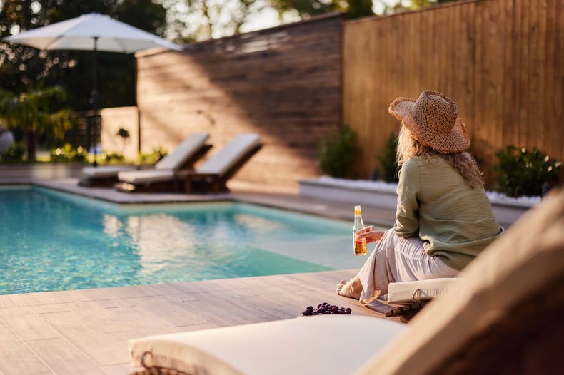 Relaxing On Outdoor Patio Furniture By Pool