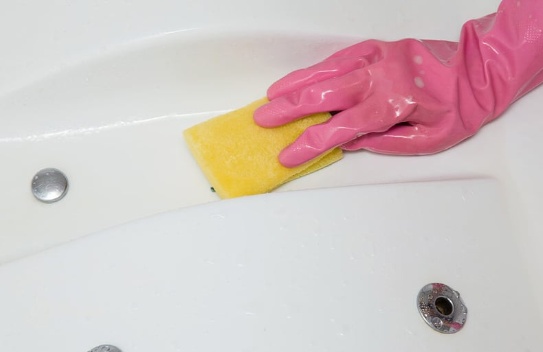 Wiping Down Hot Tub Shell With Sponge