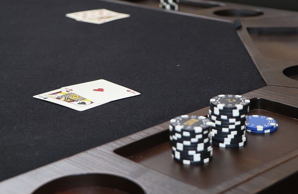 Brown Wooden Poker Table With Chips