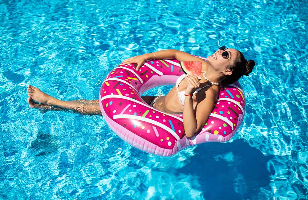 Woman Floating In Above Ground Pool