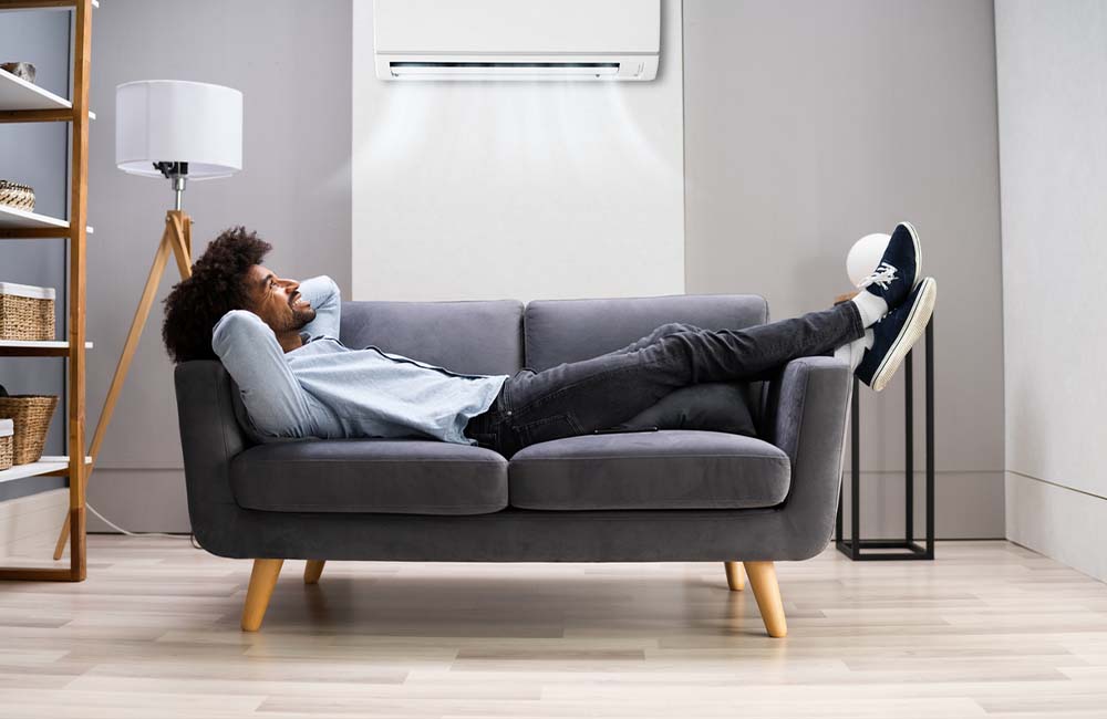 Man sitting on loveseat 